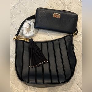 Black leather MK purse and large zipper wallet.